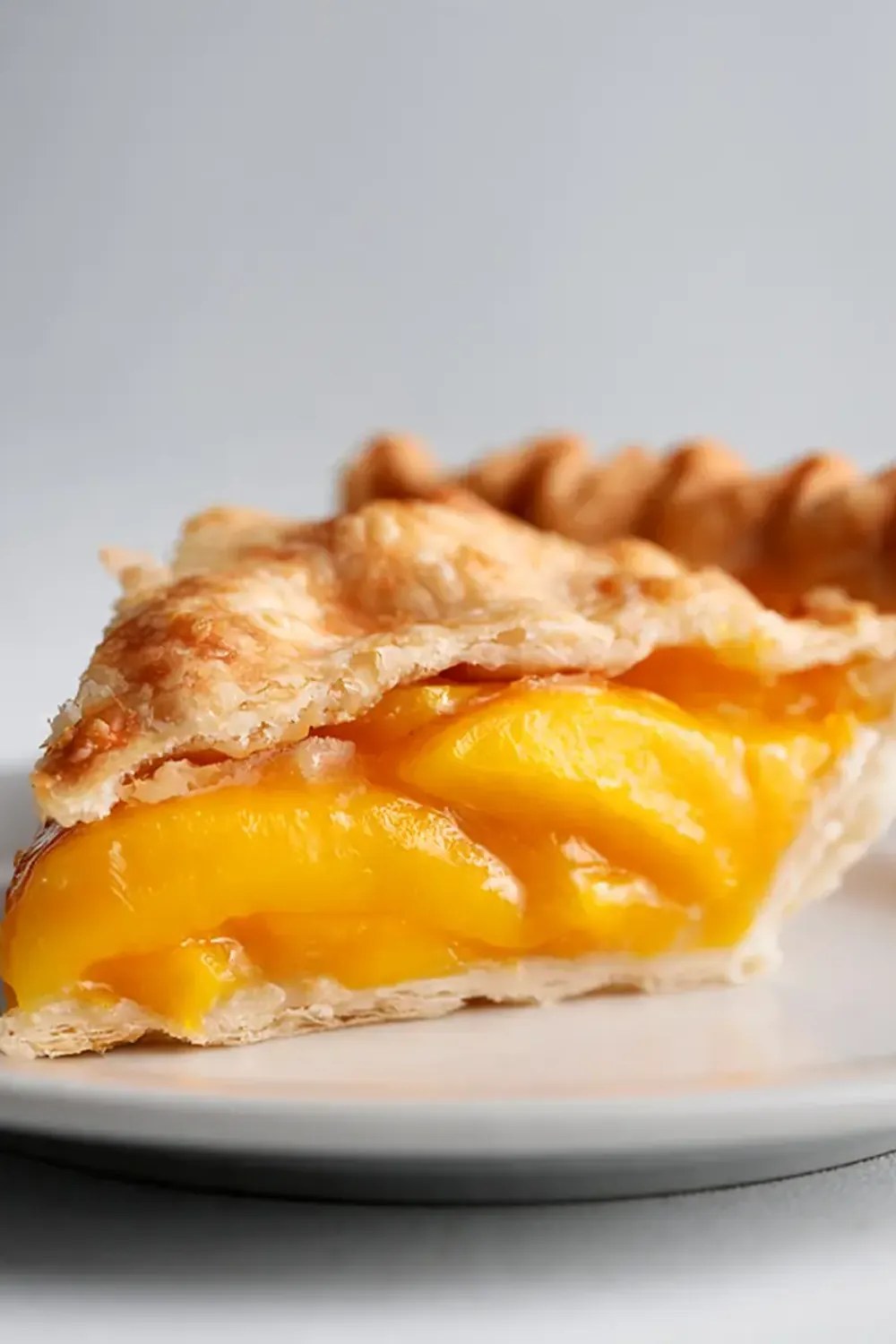 Sweet Peach Mango Pie with Flaky Pastry Crust